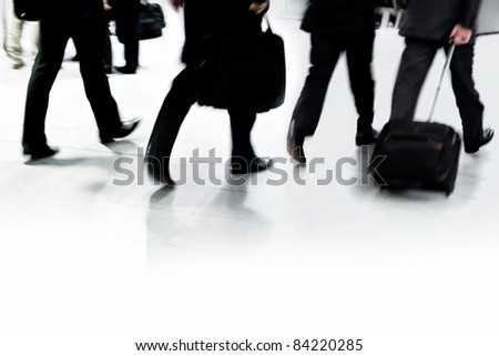 People walking in a modern interior, motion blur.Motion Blurred People.People walking in a corridor, motion blur, toned image.