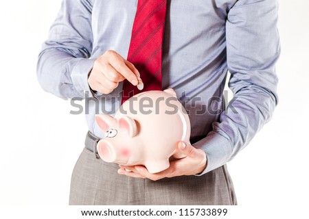 business man holding a pig bank - economy savings