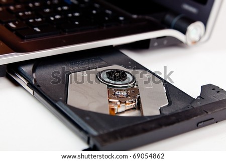 close up of a laptop with opened dvd tray