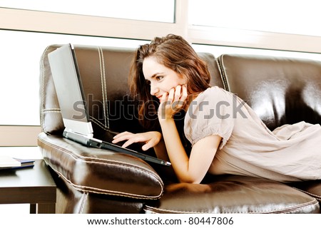 portrait of a beautiful woman using a laptop - casual still life