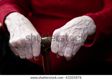 elderly hands on cane