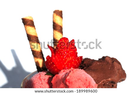 ice cream on white with shadow, with strawberry and biscuit, selective focus