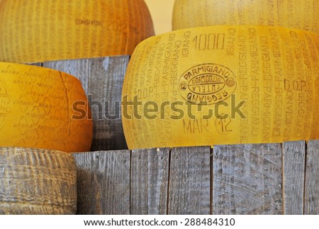 MILAN, ITALY - MAY 28, 2015: Parmigiano Reggiano or parmesan, the king of cheeses, traditional Italian cheese with a protected designation of origin under Italian and European law