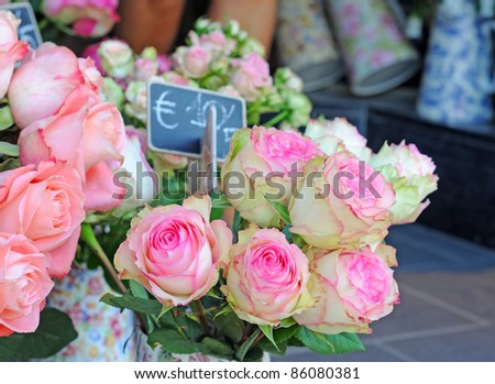 Pink and white roses on the market place, shallow depth of field