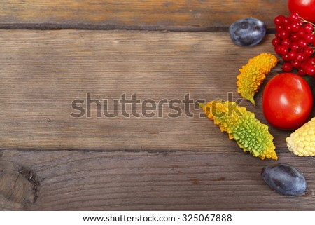 Fruit background. Fresh organic fruit, vegetable and berry on old wood. Autumn harvest