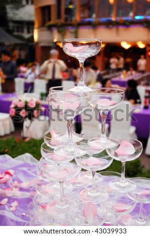 champagne tower of weddings with rose petals