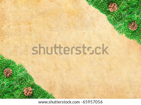 Christmas green framework with Pine needles and cones  isolated on paper textures background