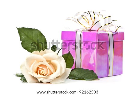 Beautiful light rose about the gift box with a white background.