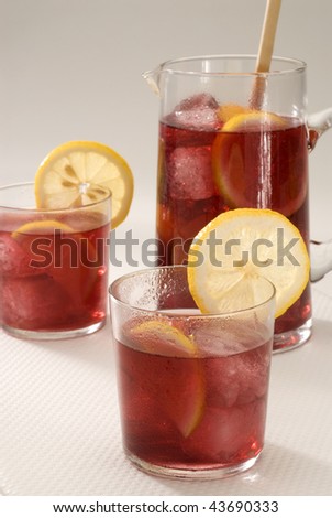 Spanish cuisine. Sangria. Red wine punch served in  glasses and a jar in background. Selective focus.