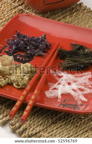 Edible seaweeds in a red plate. Selective focus.