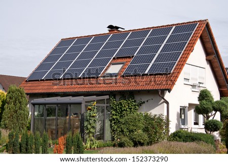 rural residence with solar panels on a roof