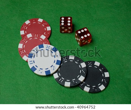 Close up of poker chips and two dice