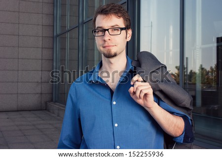 young startup businessman in front of a modern office building