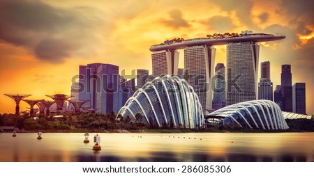SINGAPORE - APRIL 2015: Marina Bay Sands, Gardens by the bay with cloud forest, flower dome and supertrees at sunset