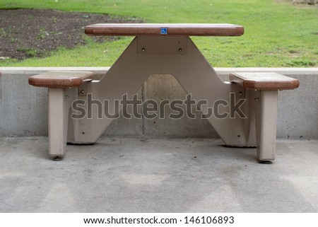 An outdoor table and benches designed to be accessible to disabled or handicapped people.
