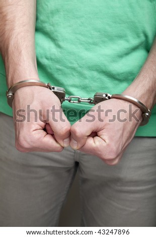 stock photo Handcuffed man Save to a lightbox Please Login