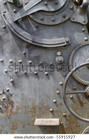 rusty sheet metal with rivets and gears