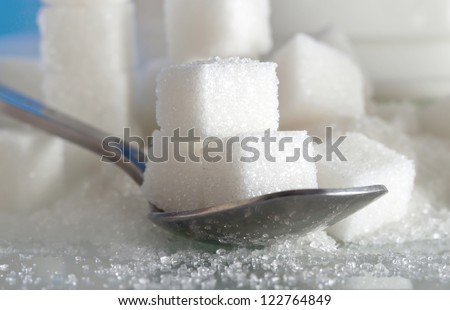 spoonful of sugar cubes with shallow depth of field