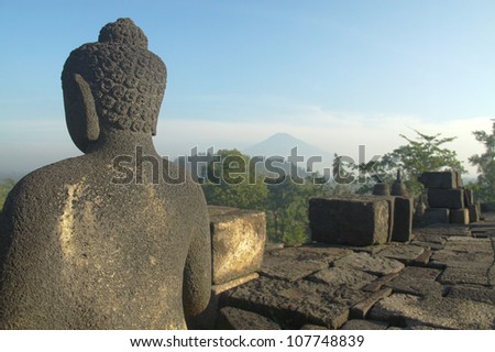 View from the back of a sculpture on Borobudur at sunrise, Java, Indonesia