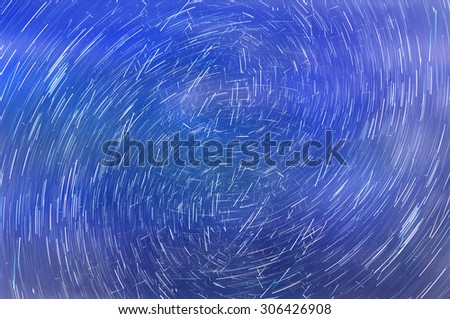 Abstract colorful decorative background with traces of the stars in the night sky