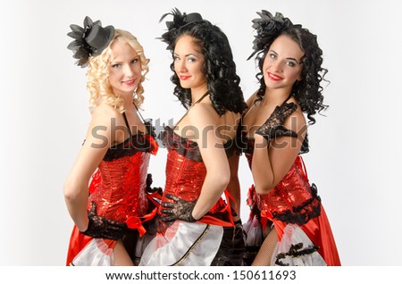 Three young girls dancing in studio a french cancan
