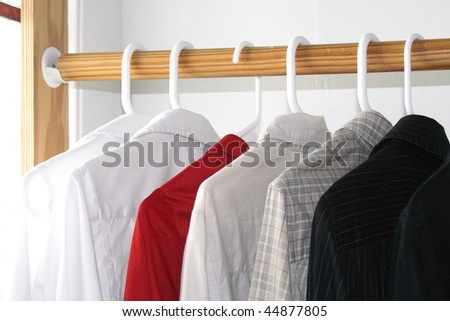 Shirts of different colors in the closet