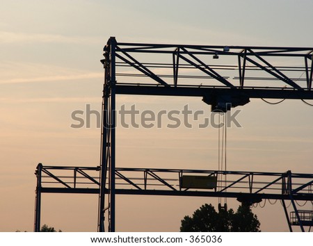 industrial scene. 2 gantry cranes at dusk