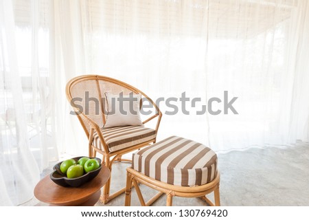 Beautiful bamboo rattan furniture in a summer setting