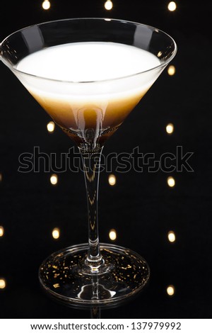 Coffee Martini cocktail in front of disco lights