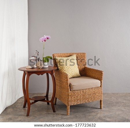 Rattan chair in a patio garden lounge setting