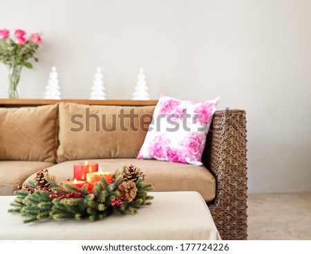 Beige upholstered sofa with advent flower arrangement