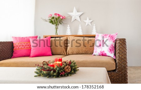 Beige sofa with colourful pillows in simple setting
