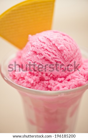 Raspberry ice cream in a tall glass