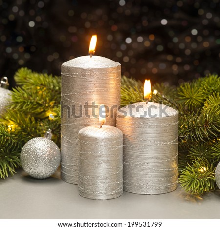Three Silver Candles with Christmas tree branches decorated