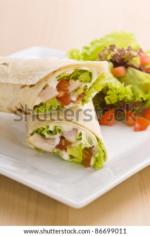 Two avocado wrap with a healthy side salad decorated