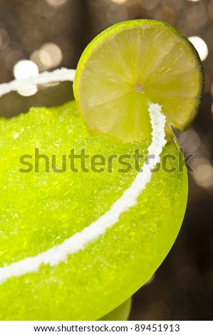 Classic margarita cocktail in front of different colored backgrounds