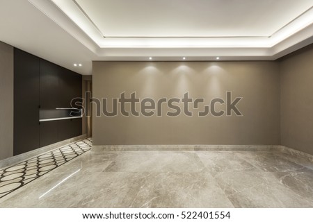 Empty room with marble flooring and beige wall paper decoration