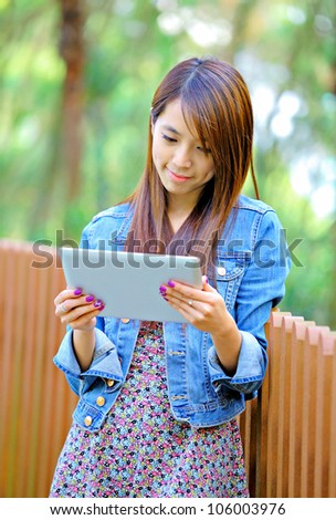 young asian woman with tablet pc