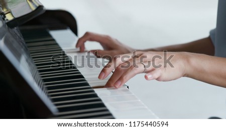 Woman play piano at outdoor