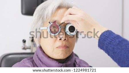 Old woman doing eye test