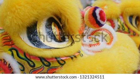 Chinese lion dance in yellow