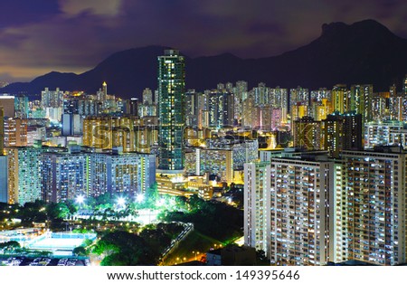 Kowloon area in Hong Kong at night with lion rock