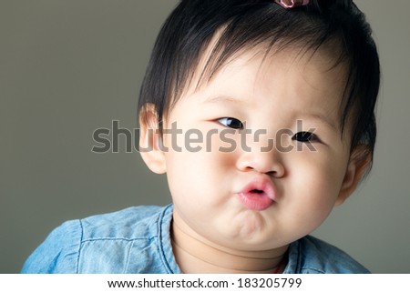 Asian baby girl purse lip