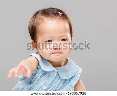 Little girl pulling hand up