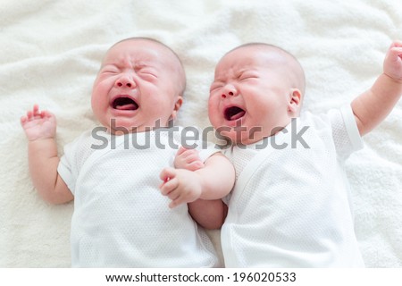 Twins brother baby crying