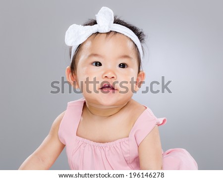 Baby girl making funny face