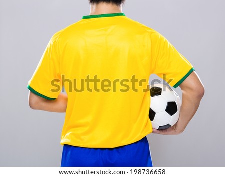 Brazil football player hold soccer ball
