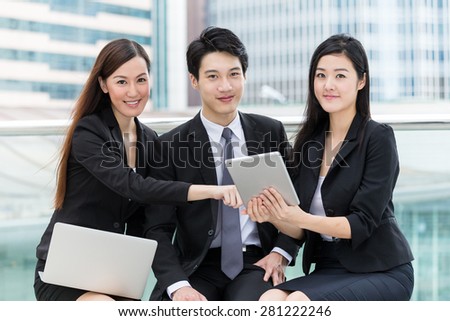 Businessman team mate using laptop and tablet together