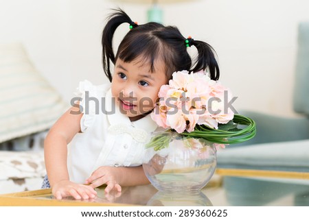 Cute girl take photo with flower