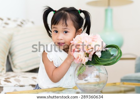 Lovely girl take photo with flower